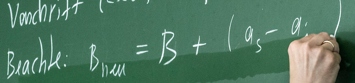 Mathematical formulas on a blackboard