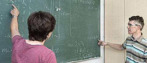 Theresa Lechner in front of a blackboard