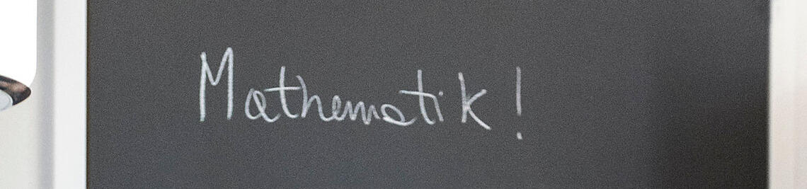 Mathematical formulas on a blackboard