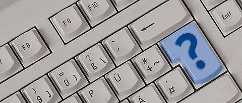 Keyboard with question mark on blue key